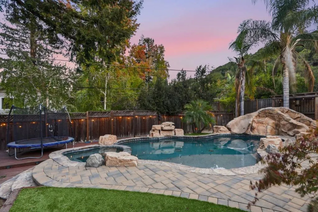 Pool and spa with rock features at twilight, Los Gatos Pool and spa with rock features at twilight, Los Gatos