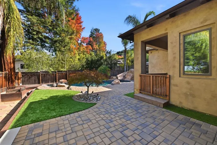Backyard lawn and paver patio beside the covered porch, Los Gatos