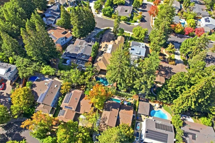 Aerial view of neighboring homes and mature trees, Los Gatos