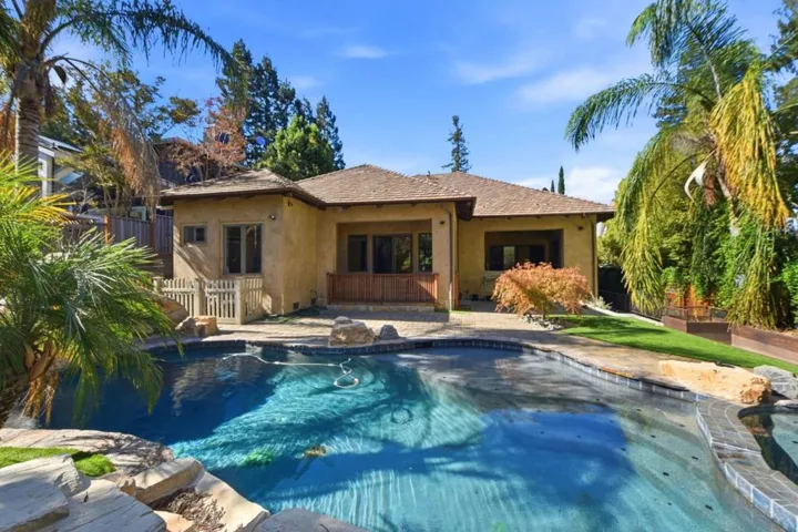 Resort-style pool and spa with paver deck and rear of the home, Los Gatos