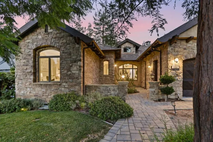 Front elevation with arched windows at sunset, Los Gatos