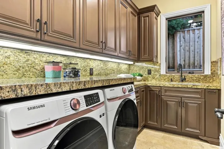Laundry room with washer, dryer and wood cabinetry, Los Gatos