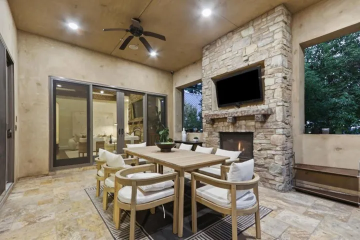 Loggia dining table with sliding doors to the pool at dusk, Los Gatos