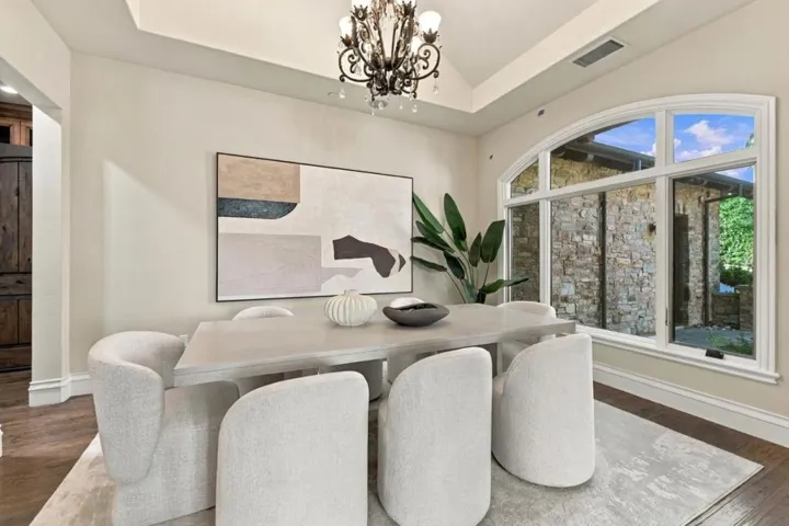 Dining room with arched window and upholstered chairs, Los Gatos