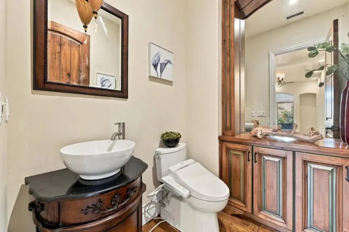 En-suite bath with vessel sink and carved wood vanity, Los Gatos