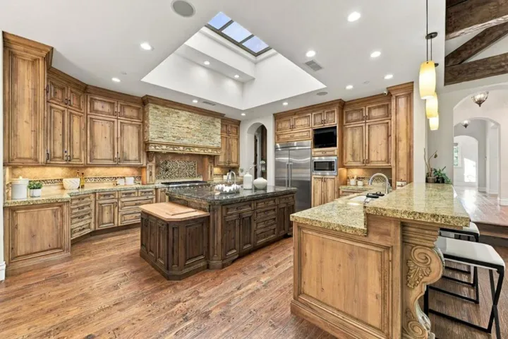 Kitchen with skylights, wood cabinetry and granite counters, Los Gatos