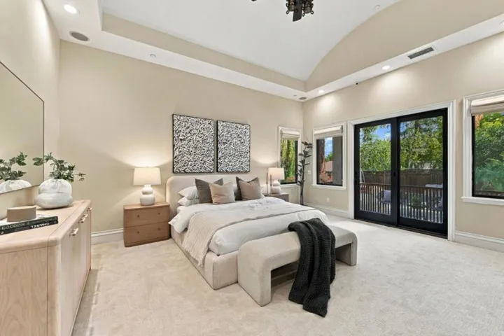 Primary bedroom with sitting bench and patio doors, Los Gatos