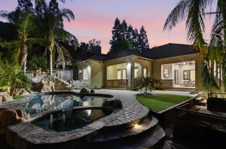 Spa and rock waterfall at twilight, Los Gatos