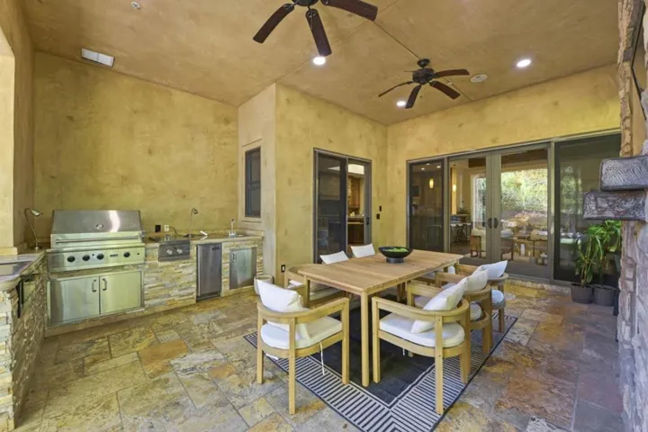 Loggia outdoor kitchen and dining table with ceiling fans, Los Gatos