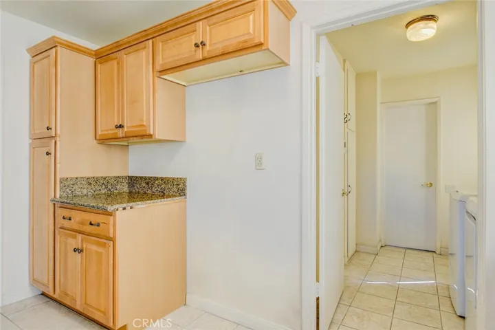 Water line to refrigerator was removed digitally.