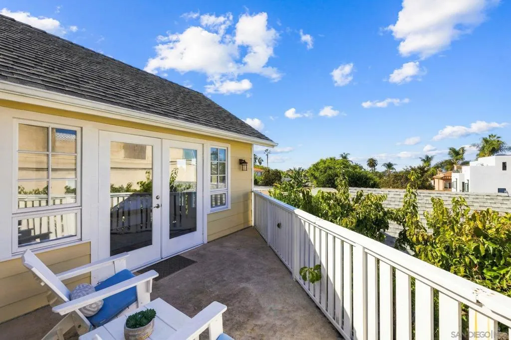 Patio off primary suite with ocean horizon views
