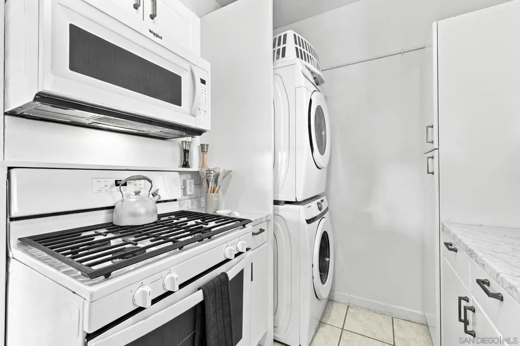 Stacked laundry in kitchen
