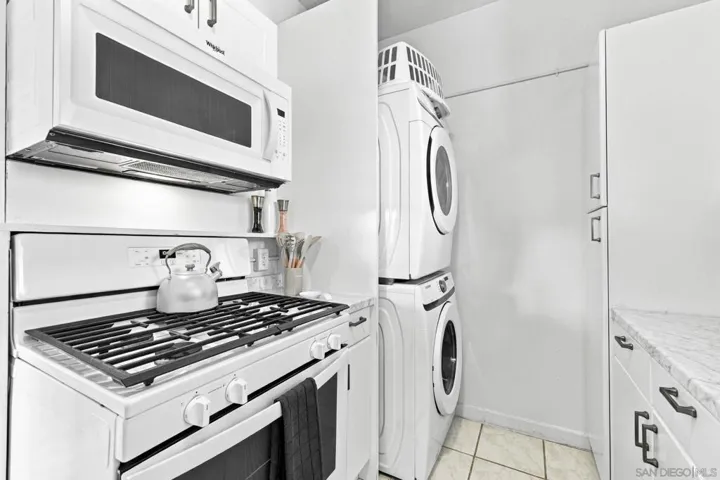 Stacked laundry in kitchen