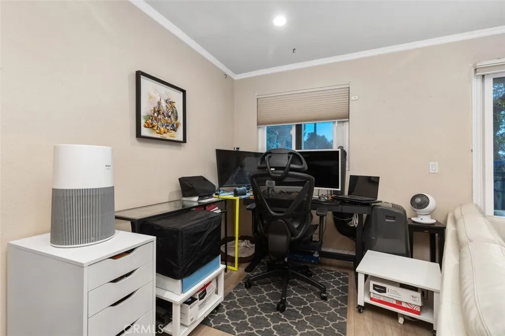 This space in the living room currently being used as an office area. This space in the living room currently being used as an office area.
