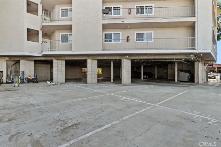 The building's parking lot is gated and also has a parking garage