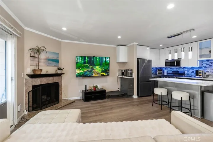 Living Room View 4 - The kitchen/living room is well suited for entertaining.