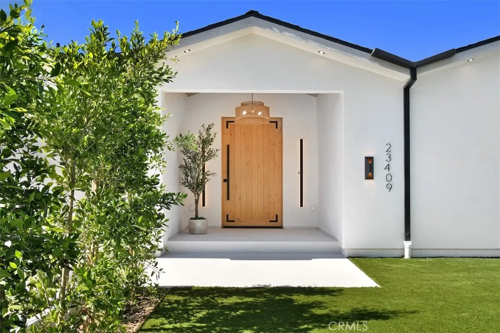 Inviting front exterior view showcasing the welcoming home facade, neat landscaping, and main entry approach. Inviting front exterior view showcasing the welcoming home facade, neat landscaping, and main entry approach.