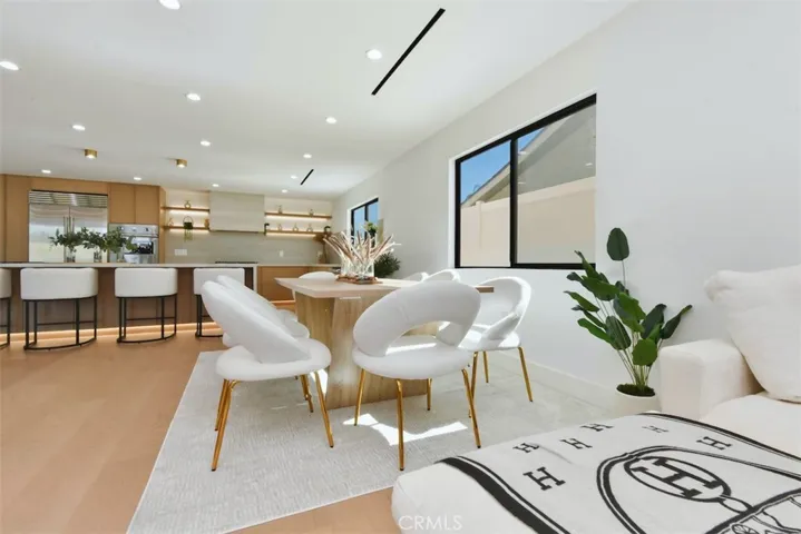 Open dining space with contemporary light fixtures and ample room for entertaining family and guests.