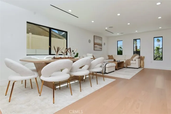 Broad perspective of the main living area highlighting the open floor plan, sleek flooring, and modern design details.
Slot 13