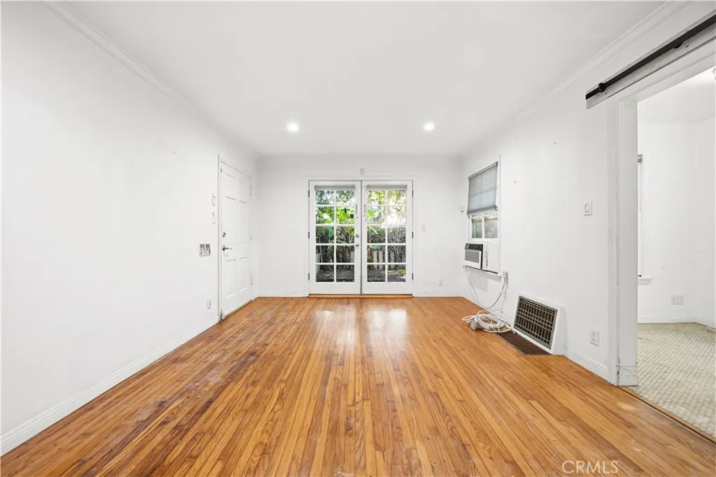 Large living room with French doors to the patio. Large living room with French doors to the patio.