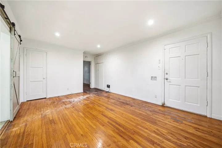 Living room with front door entrance.