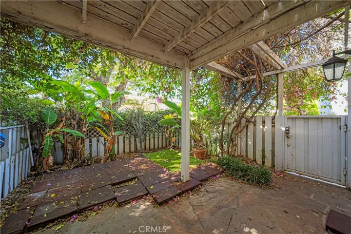 Large patio with gated entrance or enter from the living room french doors.