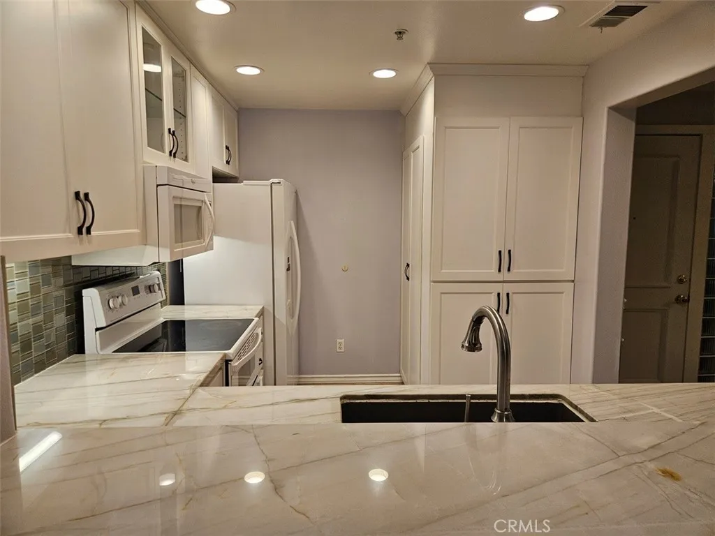 Marble countertops and tons of storage.
