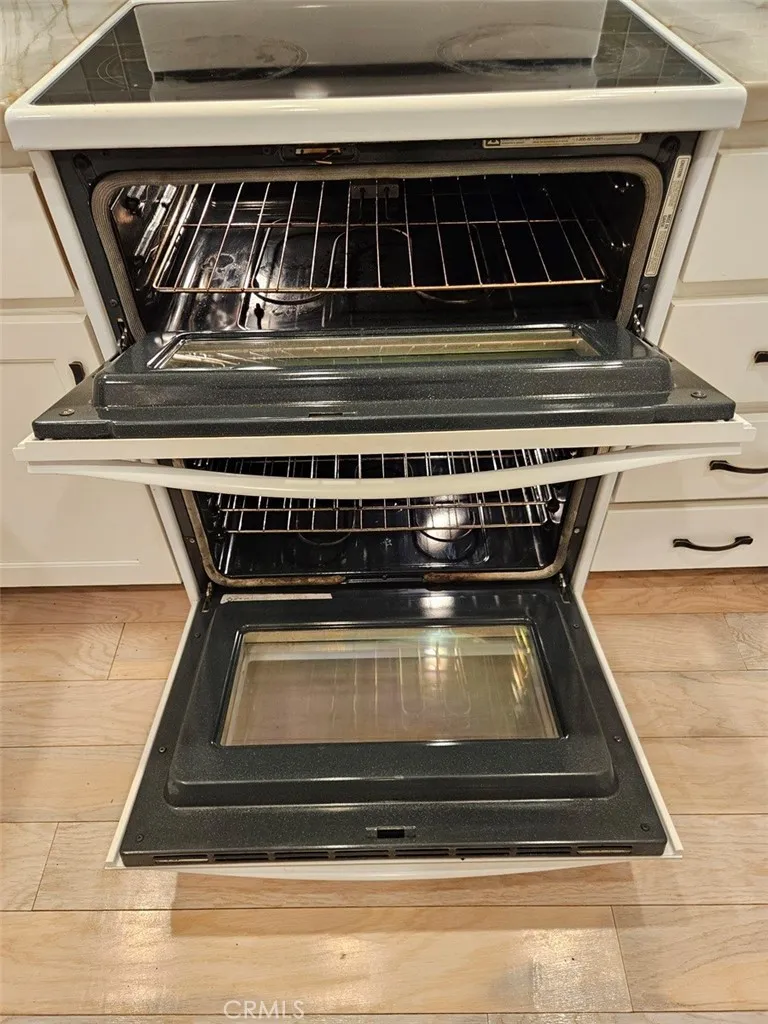 Double electric oven and stovetop.
