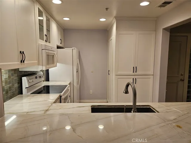 Marble countertops and tons of storage.