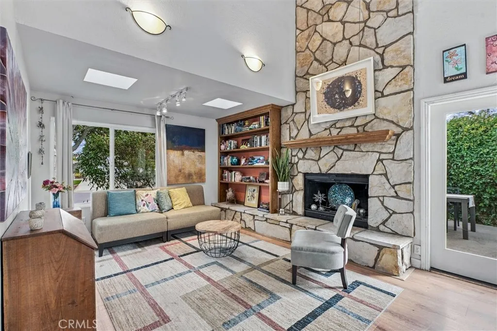 The focal point of this light infused living room is the original rock gas fireplace and next to the fireplace is a French door that opens to a private al fresco dining patio The focal point of this light infused living room is the original rock gas fireplace and next to the fireplace is a French door that opens to a private al fresco dining patio