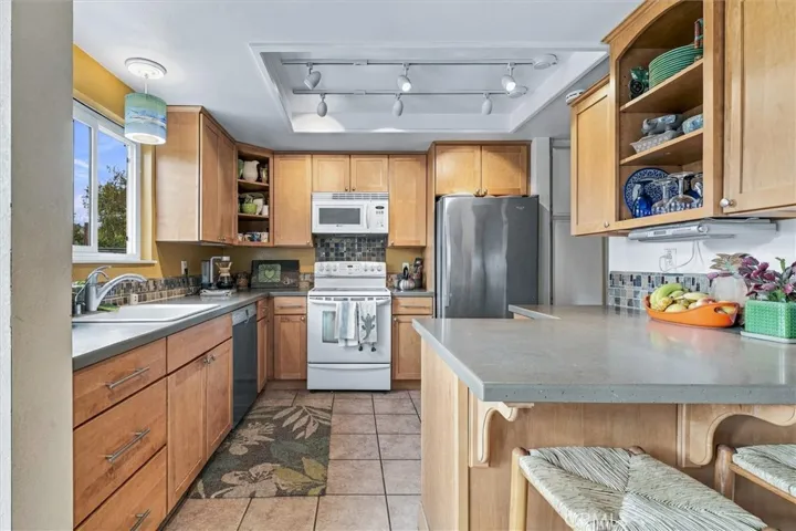 Well designed and efficient use of space with indestructible Corian counters and tile flooring.
