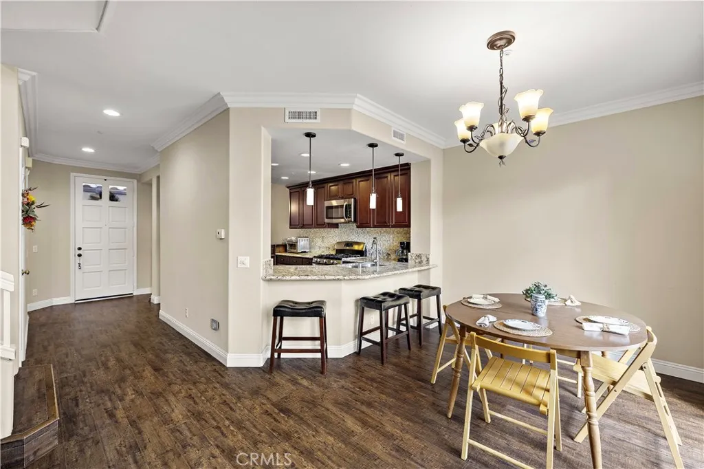 Dining room adjacent to living room and kitchen. Dining room adjacent to living room and kitchen.