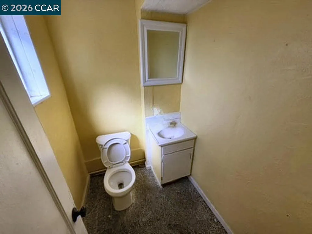 Restroom. Digitally altered: personal property and debris removed. Unaltered photo available.