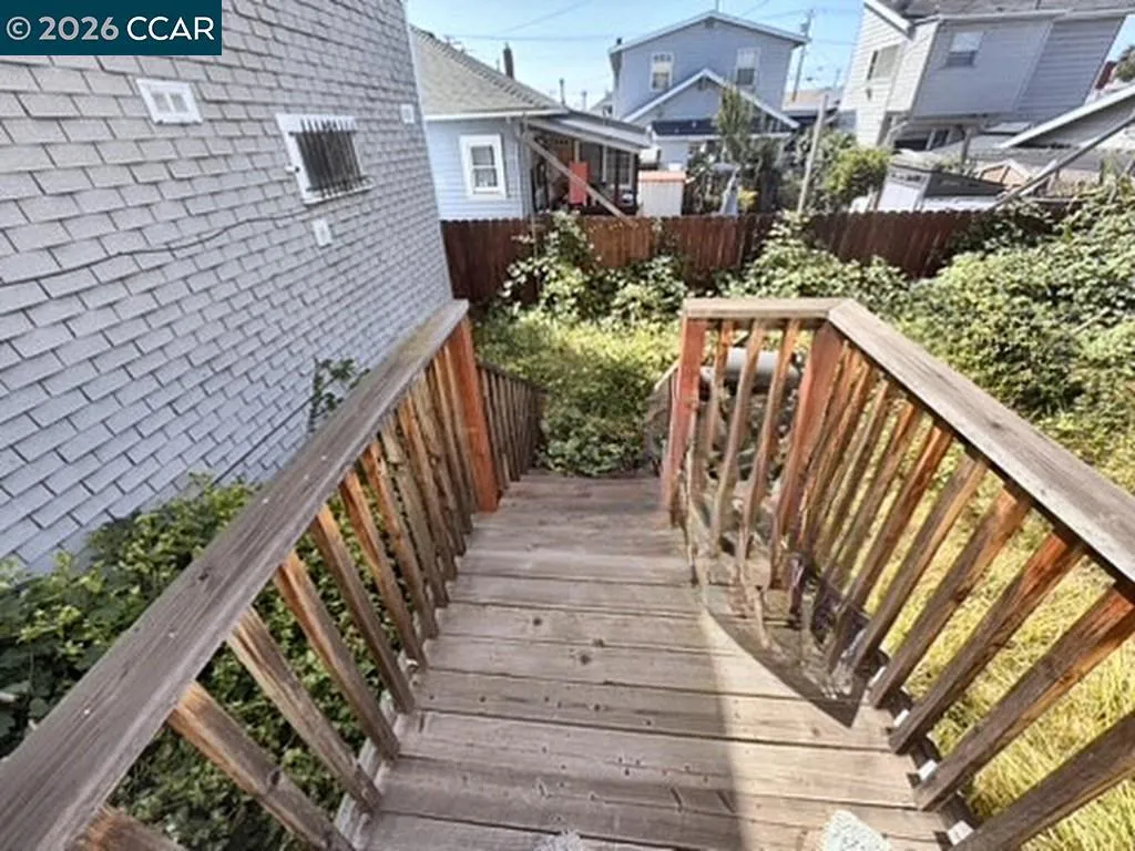 Rear deck. Digitally altered: personal property and debris removed. Unaltered photo available.
