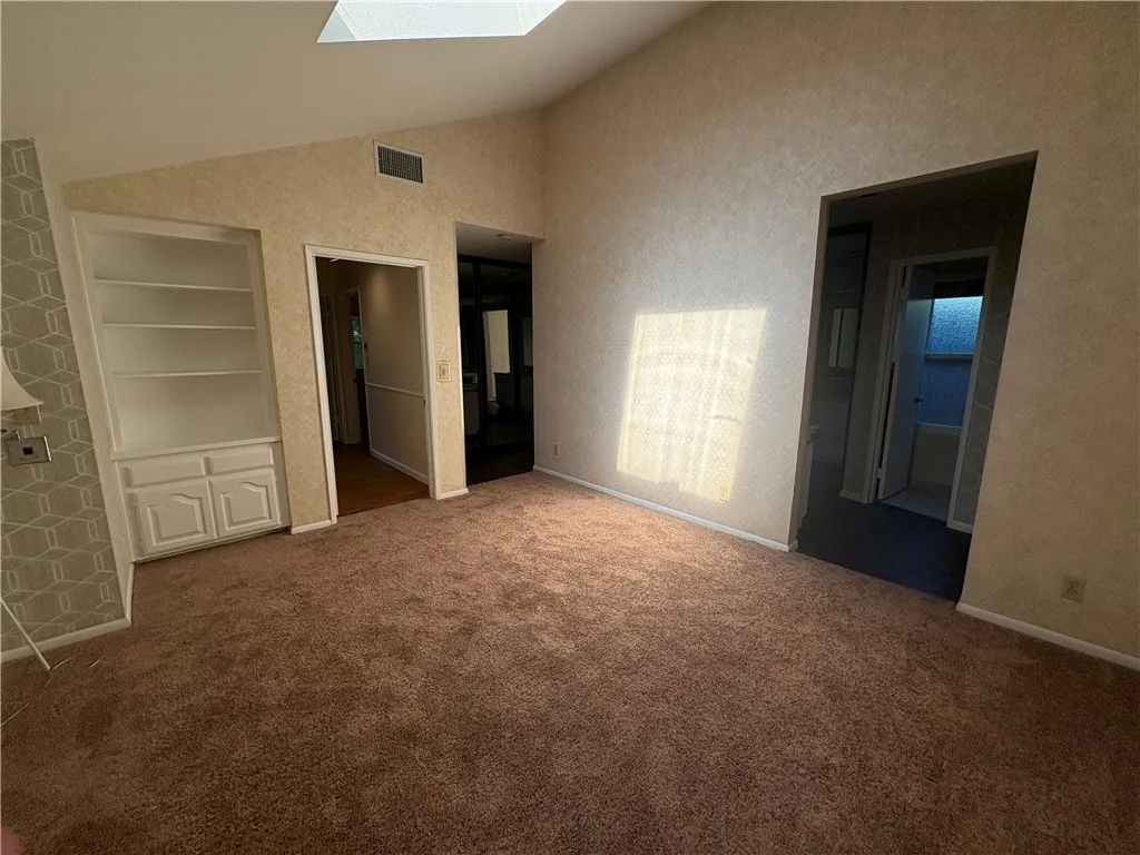 Bedroom looking towards bathroom and entrance Bedroom looking towards bathroom and entrance