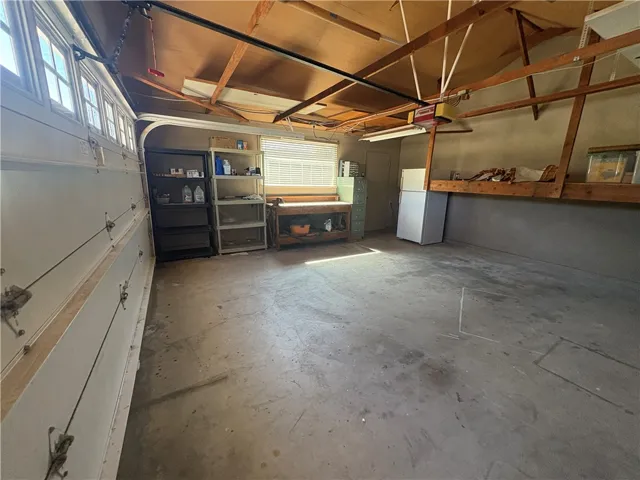 Garage door to left, entrance to right