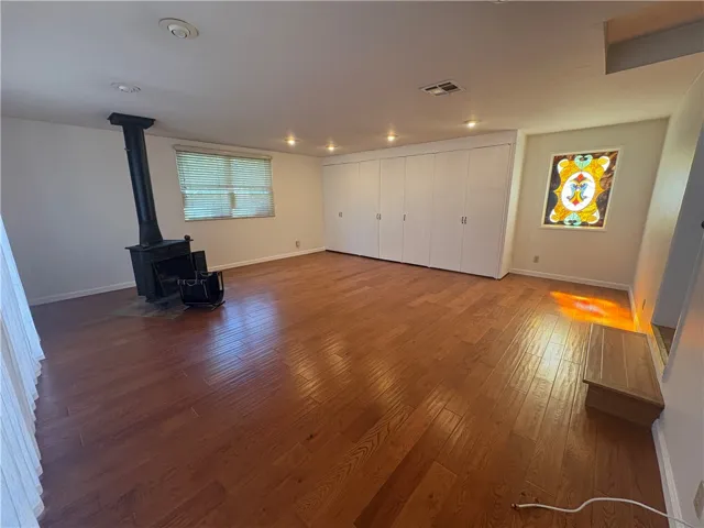 Den, laundry room to the right