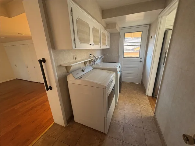 Laundry room, den to the left, backyard entry to center, kitchen to right side.