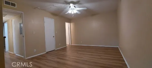 The primary suite is spacious enough for a king size bed plus additional furniture. The door in the middle of the room leads to a large walk-in closet.  The open door at the end of the room takes you to the recently remodeled bathroom, with a walk-in shower!
