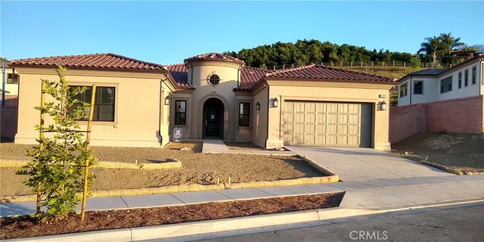 Front Elevation: Lucenta Spanish Colonial.