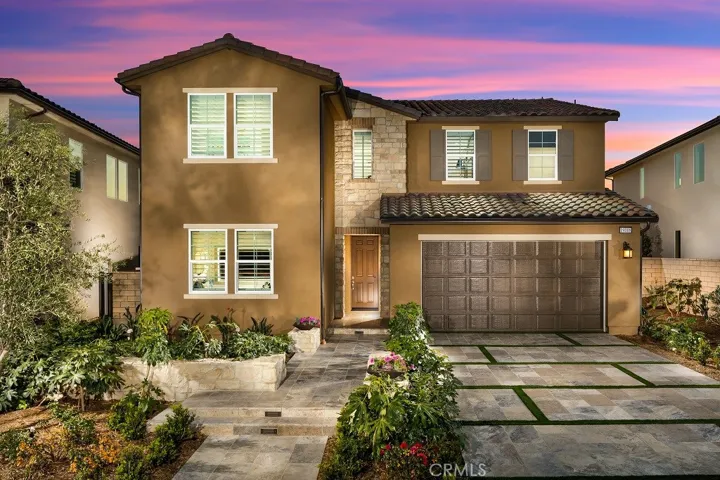 Front Elevation: Versilia Tuscan. Photos of model home not actual home for sale. Home is still under construction.