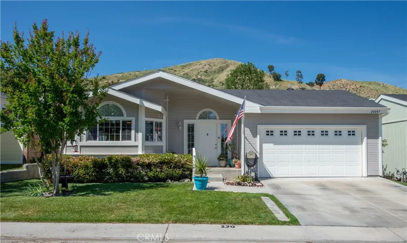 Front with true two car driveway.