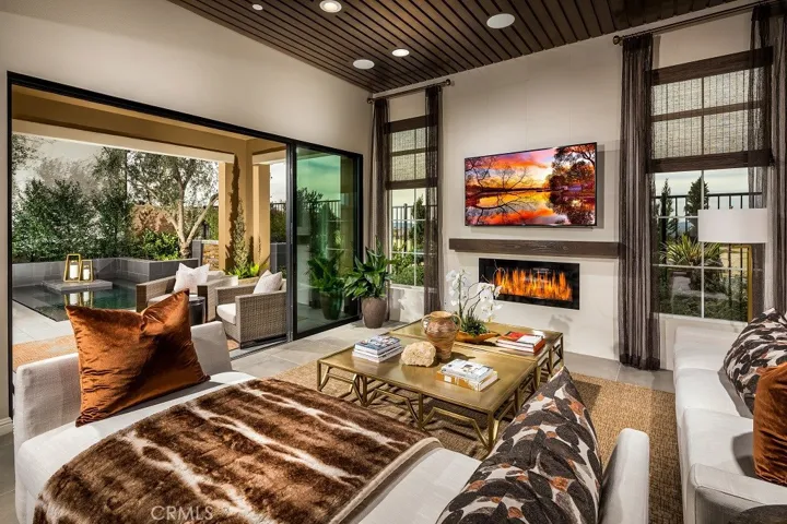 Family Room to Outdoor Room. Photos of model home not actual home for Sale, home is still under construction.