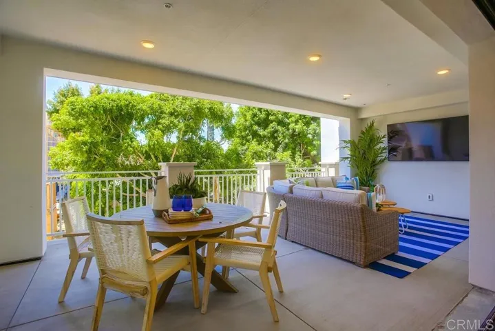 The Great Rooms open to expansive covered decks accessed through a pocket door systems (up to 12' wide) for optimal indoor-outdoor living. Natural gas, media connections & electrical outlets are provided for your convenience. Plan 2 model shown here.