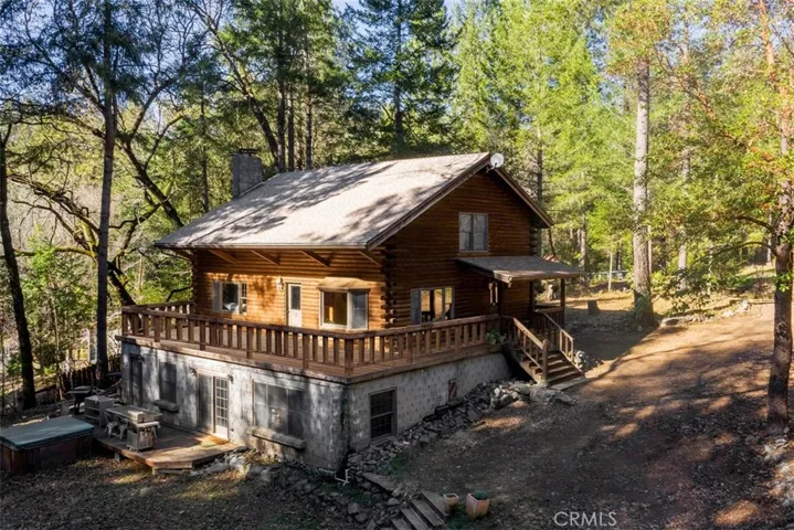 Surround deck is being installed and upgraded to redwood decking currently.  Faux rock would look great on the first floor if you chose to install after purchase.