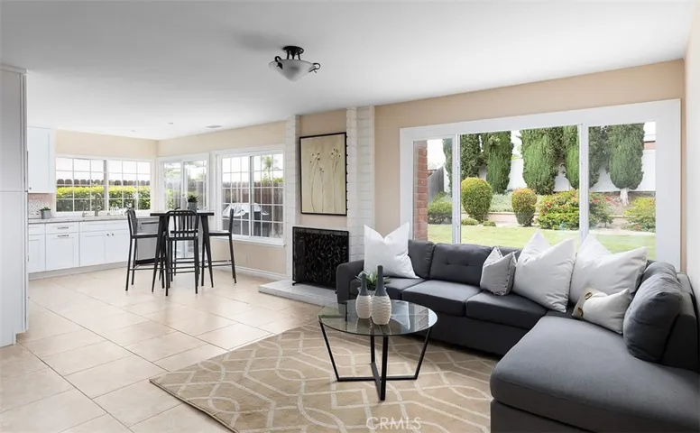 Light, bright, and airy open kitchen, breakfast area, fireplace, and family area (TV on opposite wall not shown)