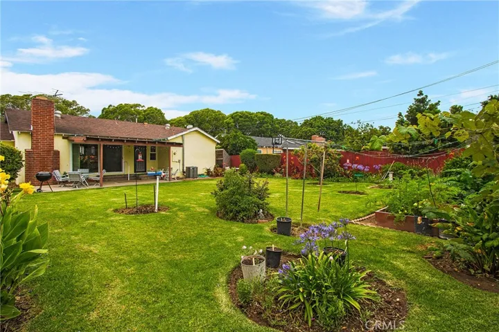 Garden boxes to the with vegetables and fruit trees throughout the property.