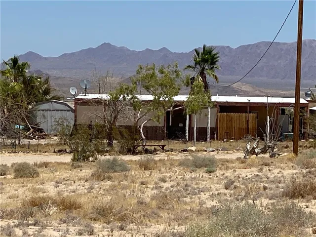 This home comes with 5 acres to realize your dreams!