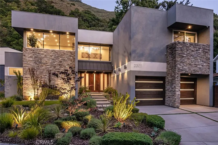 This sophisticated home awaits you. Marvel in its size comparative to others in the area.  Take note in the lush drought tolerant native landscaping.  11 foot Custom Hand-Crafted Douglas Fir solid wood door has 5 panels of satin etched Insulated Tempered Glass.  The oversized garage is appointed with two 9 foot x 8 foot Western Cedar Carriage doors w/ horizontal white laminate glass strips.