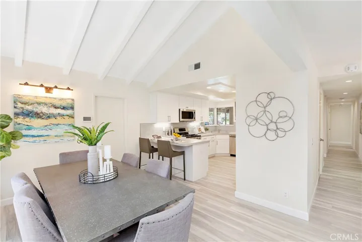 Beautifully remodeled open concept home!  Just look at that vaulted, beamed ceiling!
